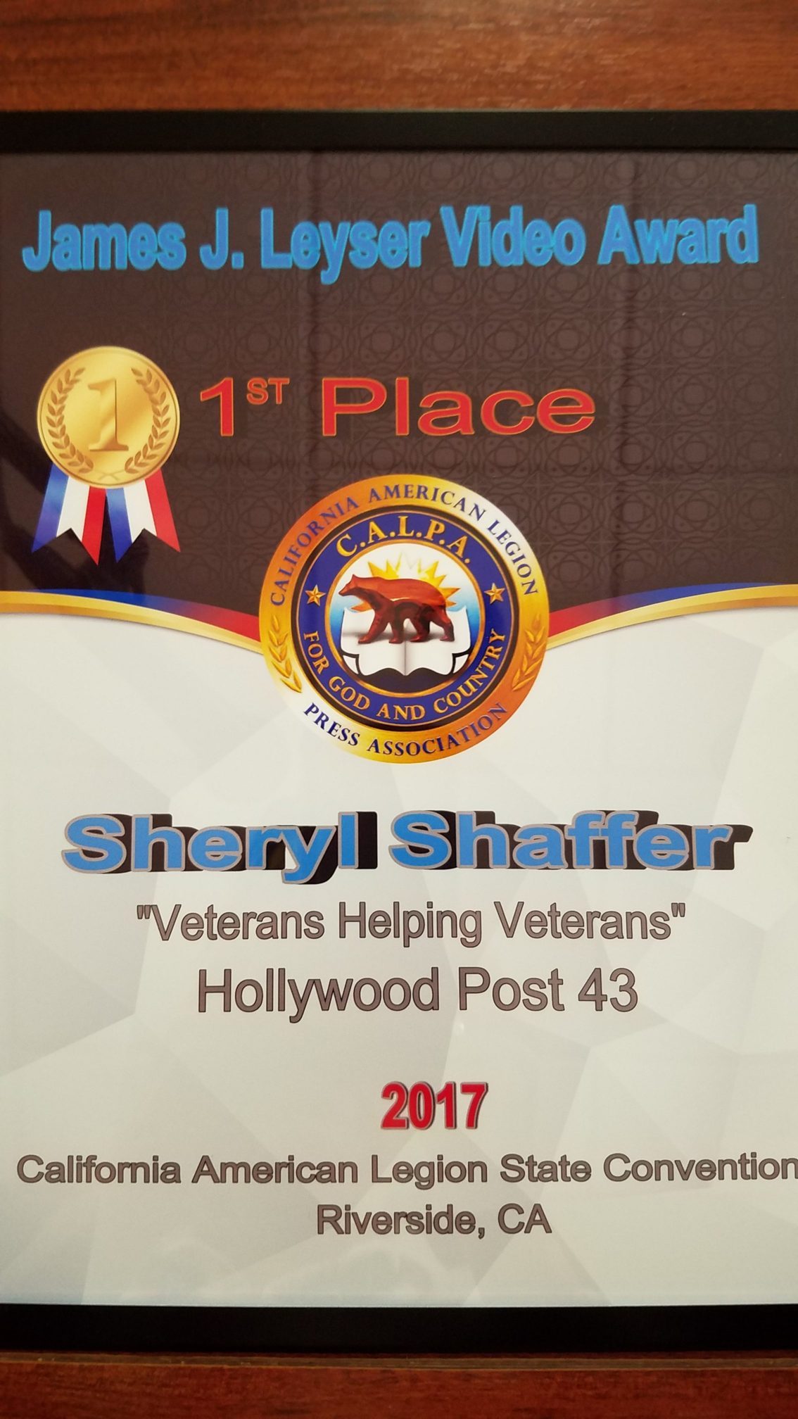 A plaque that says 1 st place and the seal of sharyl staffer.